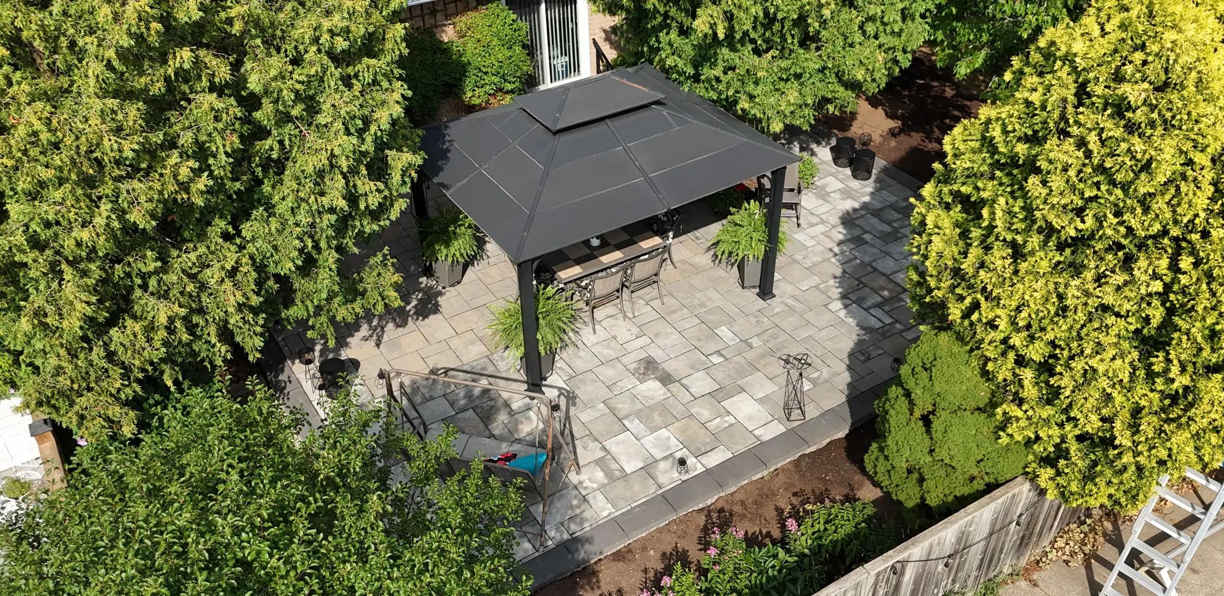 Aerial view of a new interlock patio with a gazebo
