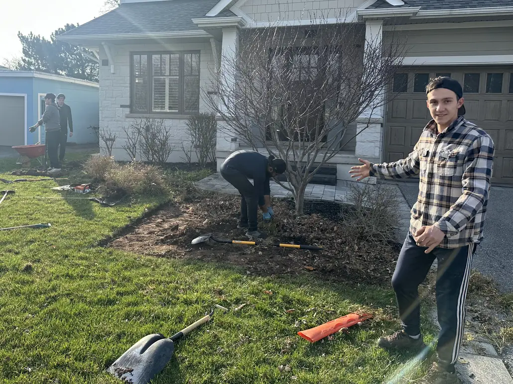 MJ Landscapers crew working on a front yard